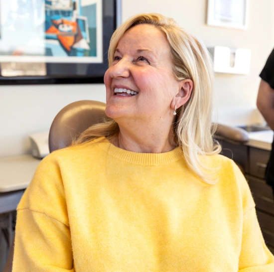 Smiling female patient feeling comfortable and at ease during a visit at Dr. Andrew Jackson DDS in Nashville, TN