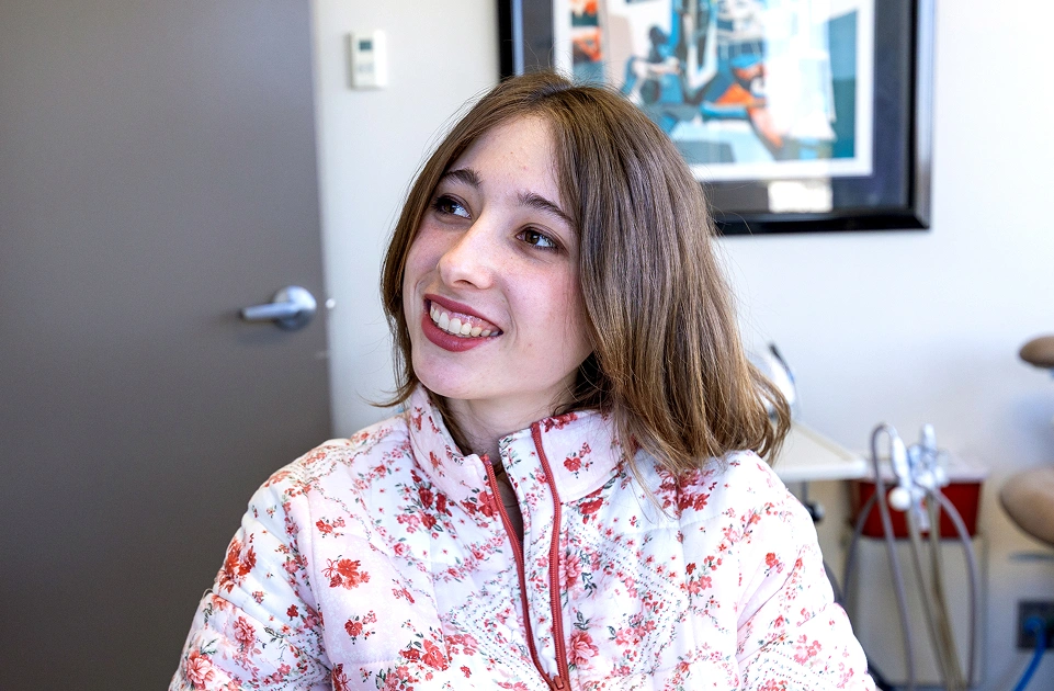 Young female patient smiling confidently after a preventive dental care visit at Dr. Andrew Jackson DDS in Nashville, TN